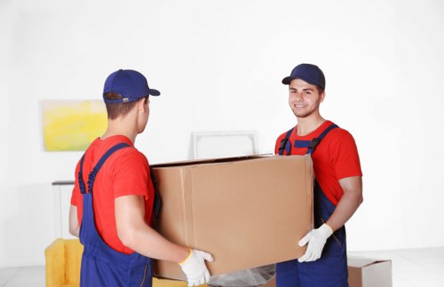 Van loading a sofa for a local move in Pimlico