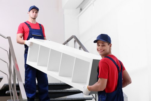 Team member preparing a moving van with safety awareness