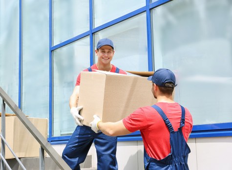 Removal team preparing a Pimlico flat move with boxes and furniture