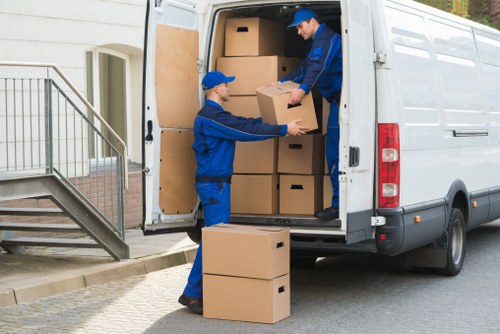 Removal vehicle loading household items near central London properties