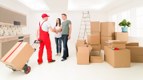 Loading household furniture into a removals van in Pimlico